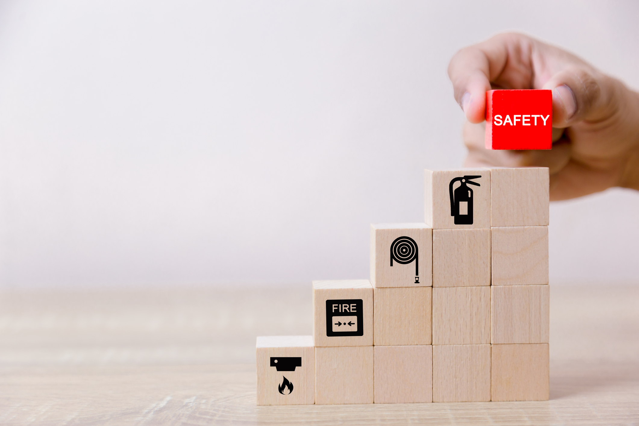 Fire signs printed on small wooden cubes stacked up